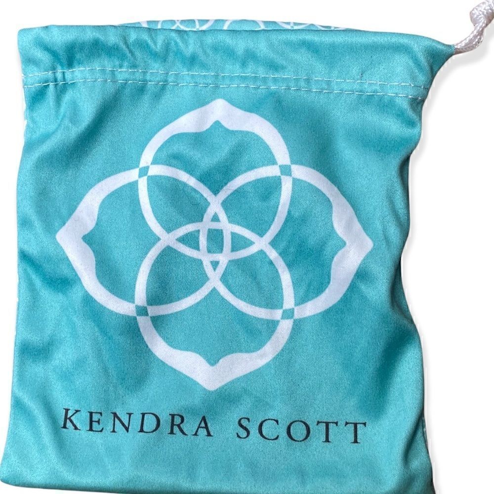 Kendra Scott jewelry bag in turquoise with white signature pattern drawstring